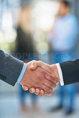Buy stock photo Shot of businesspeople shaking hands