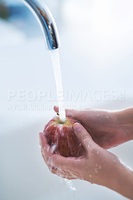 Buy stock photo Water splash, hands and person cleaning apple, hygiene in kitchen with sustainability and disinfection, germs or bacteria. Health, wellness and nutrition with fruit, organic and fresh food at home