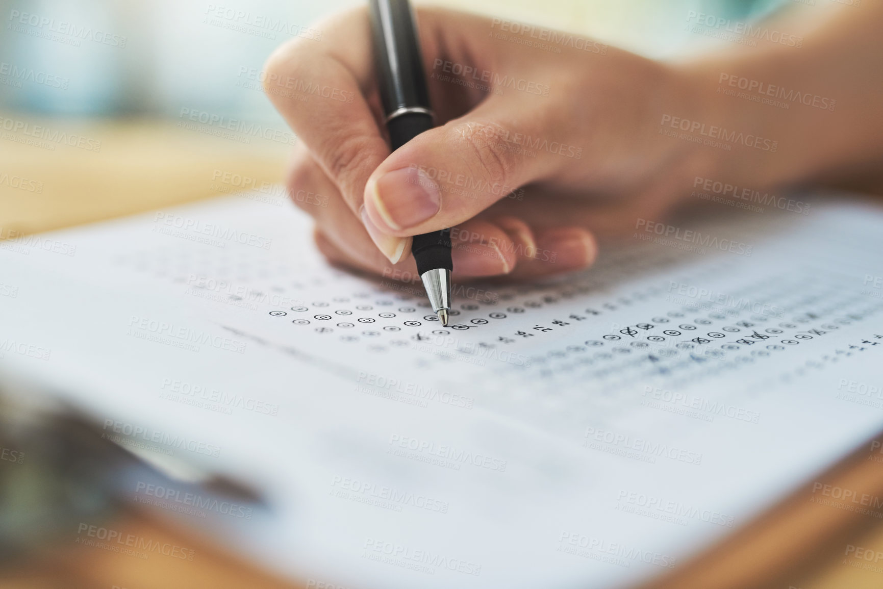 Buy stock photo Woman, hand and writing a test with choice on clipboard for exam assessment, quiz and closeup of answer sheet. Paperwork, student and form with cross for learners license, education and scholarship