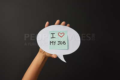 Buy stock photo Hand, speech bubble and person with I love my job, company review and feedback on dark studio background. Model, mockup space and girl with comment and workplace culture with paper and job promotion