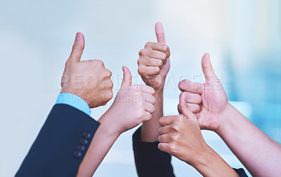 Buy stock photo Shot of a group of office workers showing thumbs up together