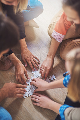 Buy stock photo Top view, people and hands with puzzle for teamwork, solution and problem solving for innovation. Closeup, team building and planning jigsaw for integration, collaboration and synergy for cooperation