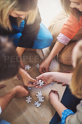 Buy stock photo Top view, people and puzzle for teamwork, support and problem solving of challenge, synergy and cooperation. Group of hands planning jigsaw for integration, collaboration and solution for innovation