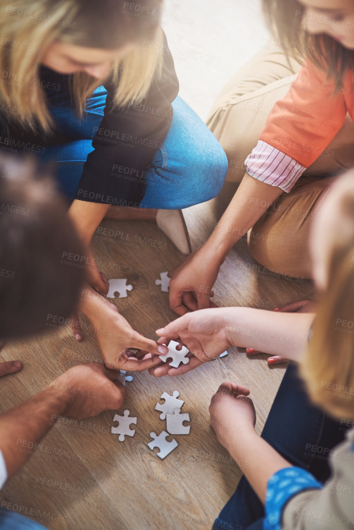 Buy stock photo Top view, people and puzzle for teamwork, support and problem solving of challenge, synergy and cooperation. Group of hands planning jigsaw for integration, collaboration and solution for innovation