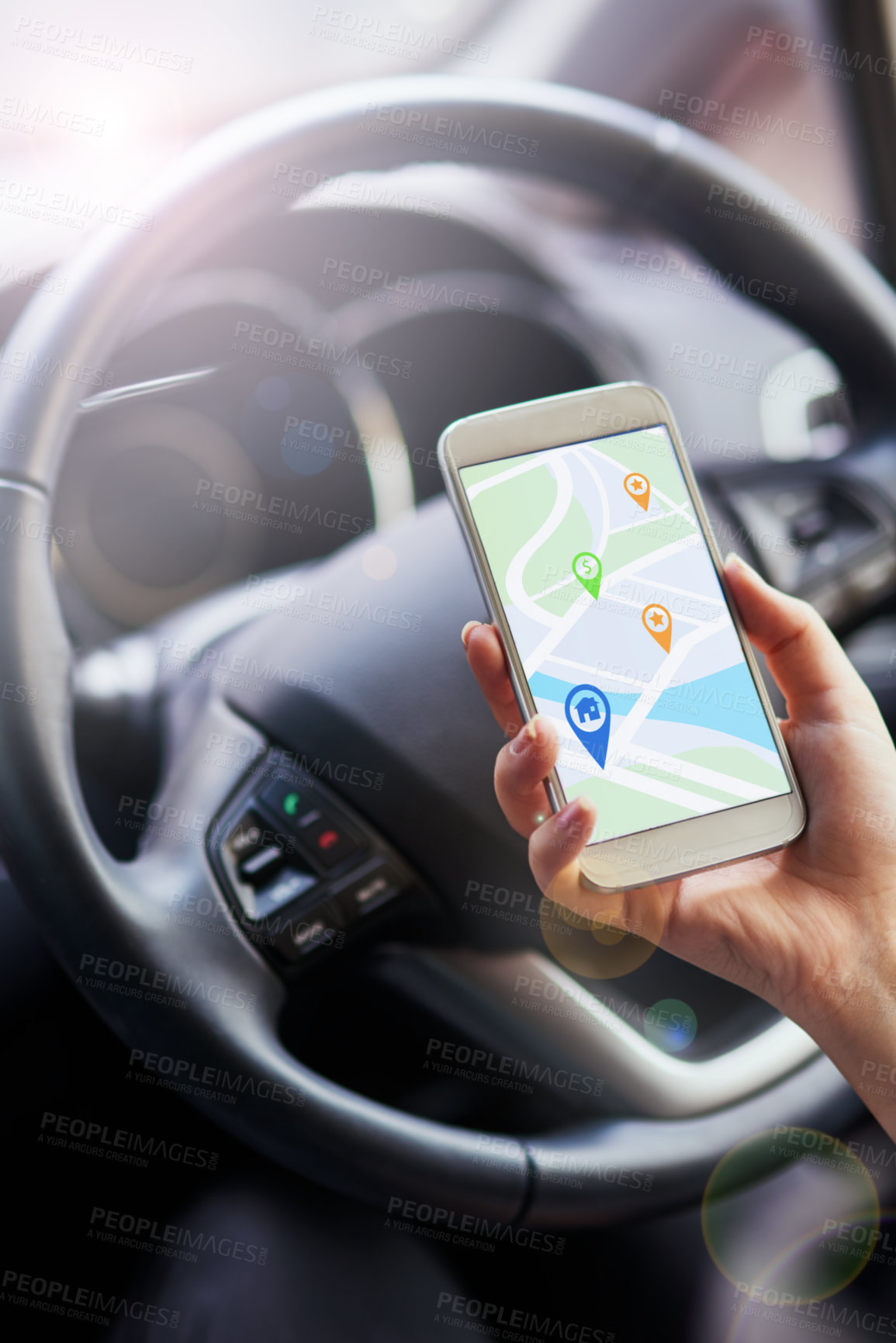 Buy stock photo Shot of a person in a car using their phone to find directions