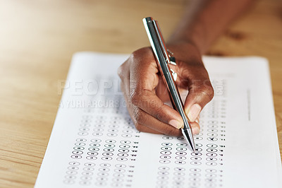 Buy stock photo Hand, pen and person with answer sheet for university test, assignment or exam in classroom. Education, table and student writing on paper for quiz, assessment or form at college campus for education