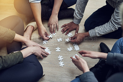 Buy stock photo Hands, business people and puzzle in circle, diversity or teamwork for problem solving, solution or above game. Group, planning and helping hand for support, synergy and team building on office floor