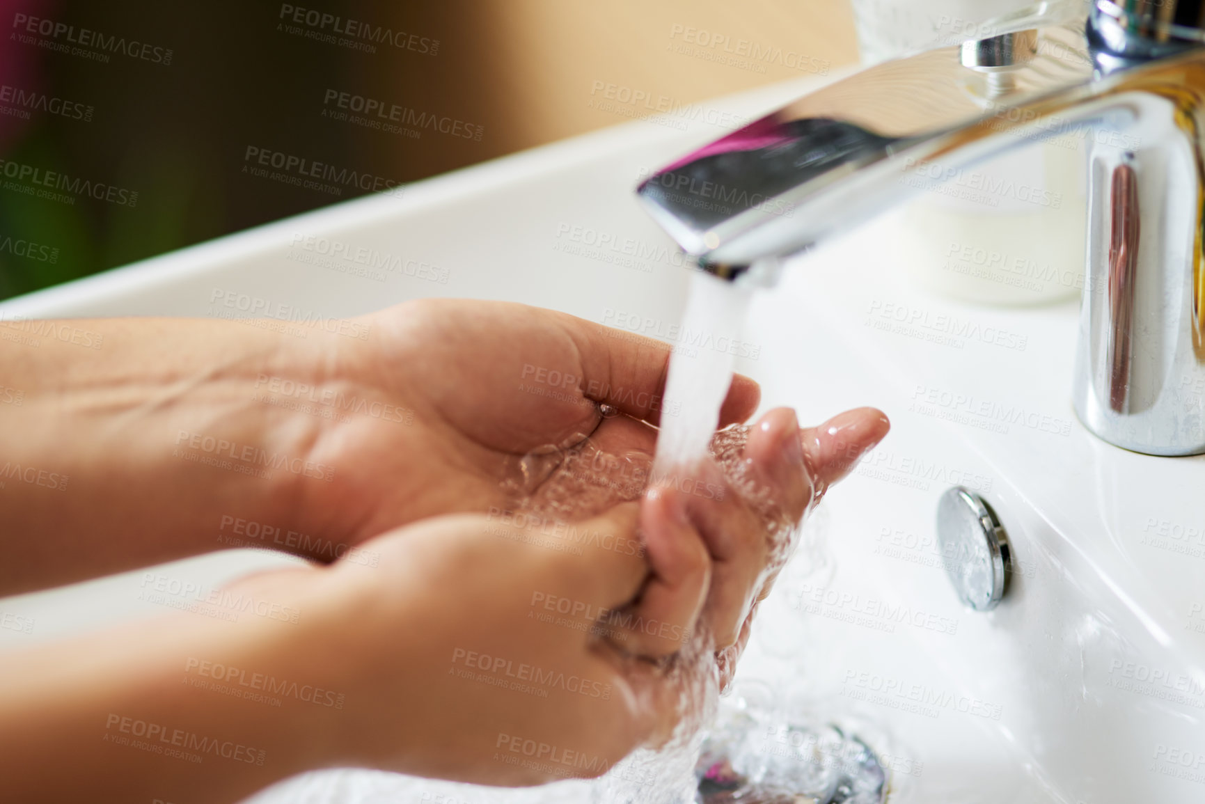 Buy stock photo Water, sink and person washing hands in house for cleaning, safety and hygiene at home. Splash, liquid and palm for prevention of dirt, bacteria or germs in bathroom with finger disinfection process