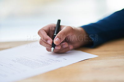 Buy stock photo Shot of a person signing paperwork