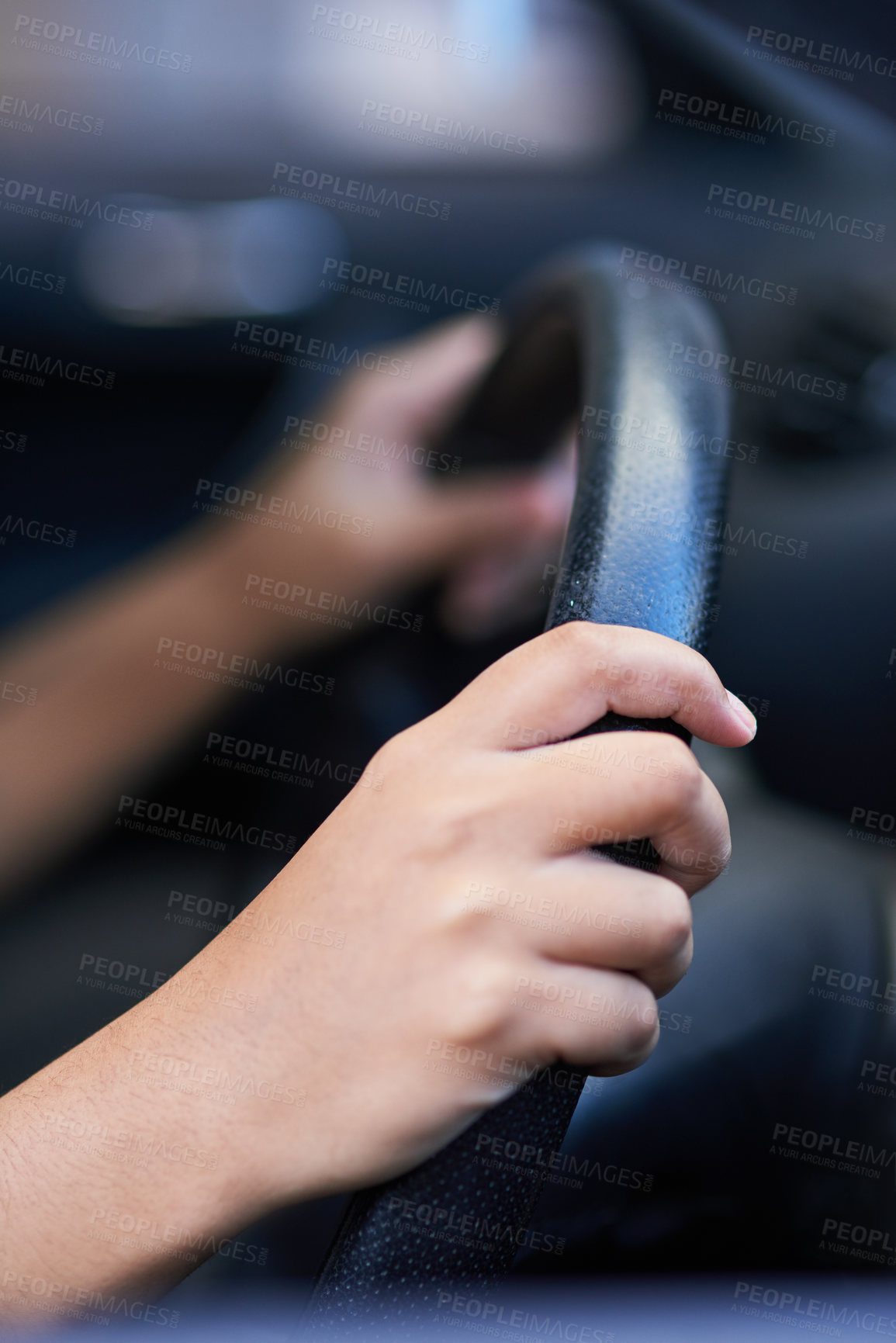 Buy stock photo Shot of hands holding onto a steering wheel while driving