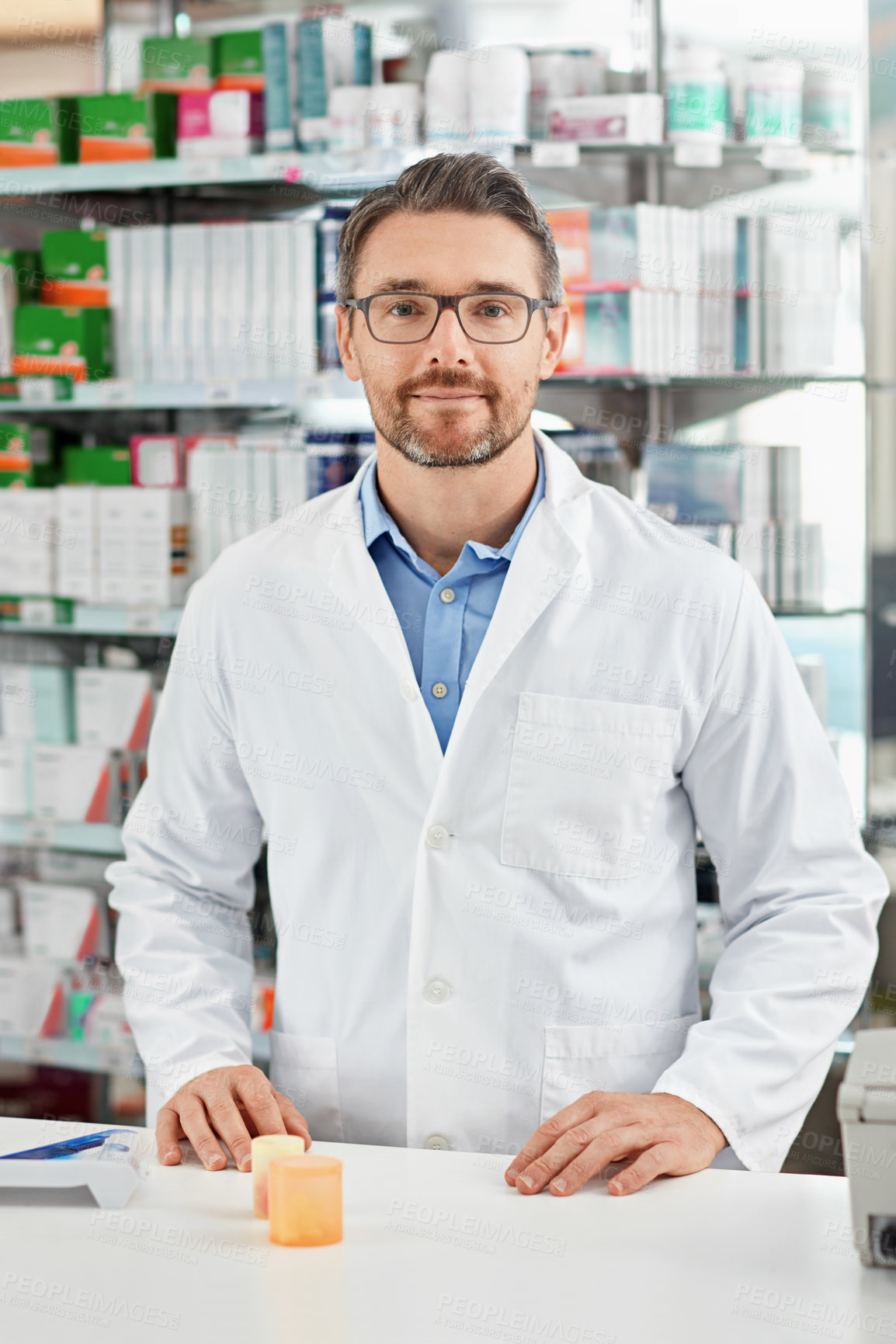 Buy stock photo Pharmacy, portrait and pharmacist man with pills bottle, medicine or product in retail or healthcare industry. Trust, help desk and medical professional worker with supplements stock or clinic drugs