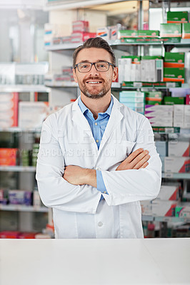 Buy stock photo Medical, portrait and male pharmacist with crossed arms for confidence standing in a pharmacy clinic. Pharmaceutical, healthcare and mature man chemist by the counter of medication store dispensary.