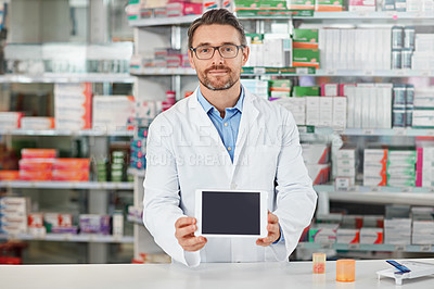 Buy stock photo Pharmacist man, shop and portrait with tablet screen, focus and focus for marketing, medication or sales. Medical professional, pharma expert and mobile digital tech in pharmacy for wellness with app