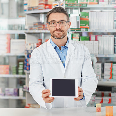 Buy stock photo Man, pharmacist and portrait with tablet screen for telehealth, medication or pharmaceutical advertising. Male person, doctor or medical worker with technology display or mockup space at dispensary