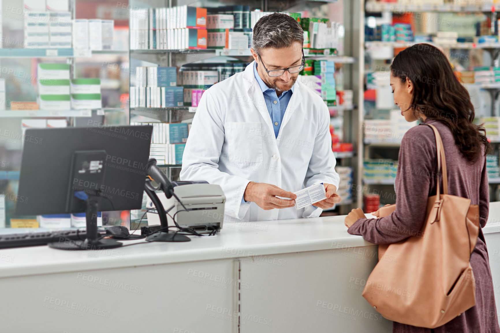 Buy stock photo Medicine, service and help of pharmacist consulting at  health store counter with expert knowledge. Medication advice and trust of girl with kind worker checking information at pharmacy.