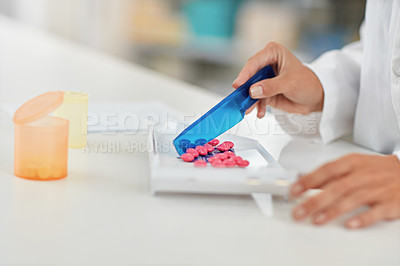 Buy stock photo Hands, pharmacist and counting pills for drug dose, packaging or prescription at a pharmacy. Hand of doctor working with medication tablets or pharmaceutical drugs for healthcare on counter at clinic