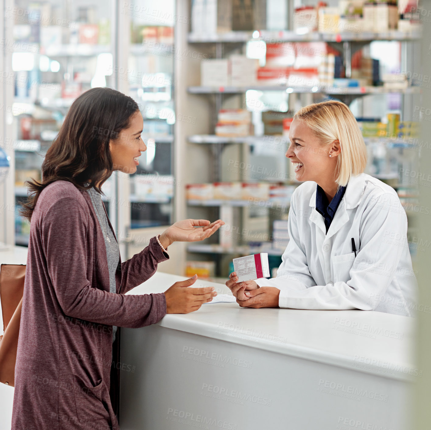 Buy stock photo Woman, pharmacist and advice in pharmacy with box, medication or pill recommendation. Happy customer, healthcare or chemist at counter for pharmaceutical, expert opinion and friendly chat for service