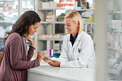Buy stock photo Happy, customer and pharmacist with healthcare medicine  assistance, help and expertise at store counter. Advice and opinion of worker helping girl with medication information at pharmacy.