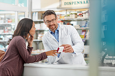 Buy stock photo Happy, healthcare and communication of pharmacist with customer at counter for professional expertise. Advice, explanation and opinion of worker helping girl with medicine information at pharmacy.