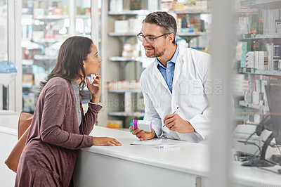 Buy stock photo Pharmacist, customer and health with medicine and advice, discussion and service in pharmacy, advice and pills prescription. Healthcare, medical store with pharmaceutical drugs, man and woman talk