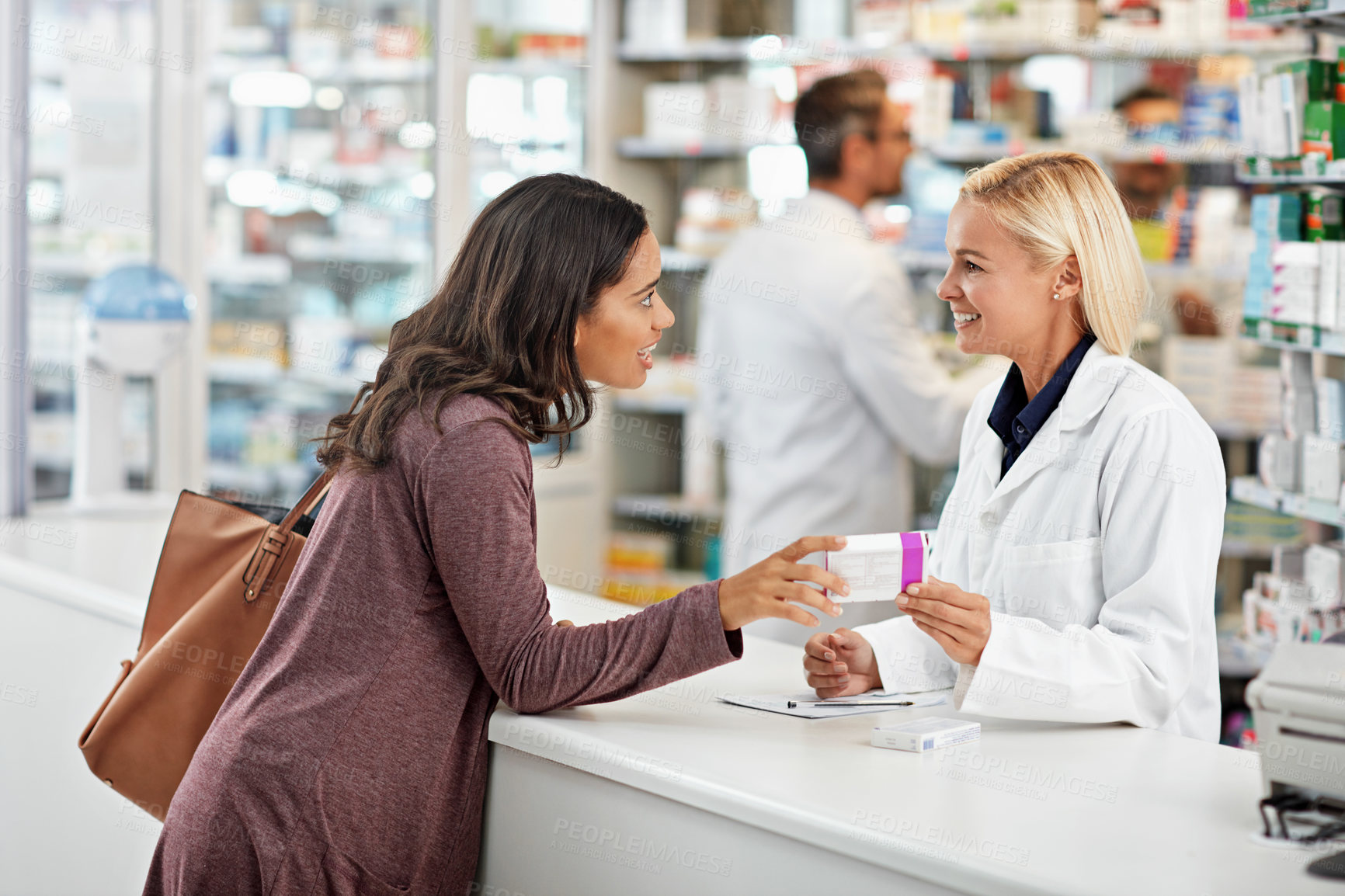 Buy stock photo Shot of a pharmacist at work in a drugstore. All products have been altered to be void of copyright infringements