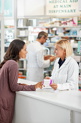 Buy stock photo Wellness, health and happy pharmacy customer at store counter for medicine expertise with smile. Pharmaceutical advice and opinion of woman pharmacist helping girl with medication information.