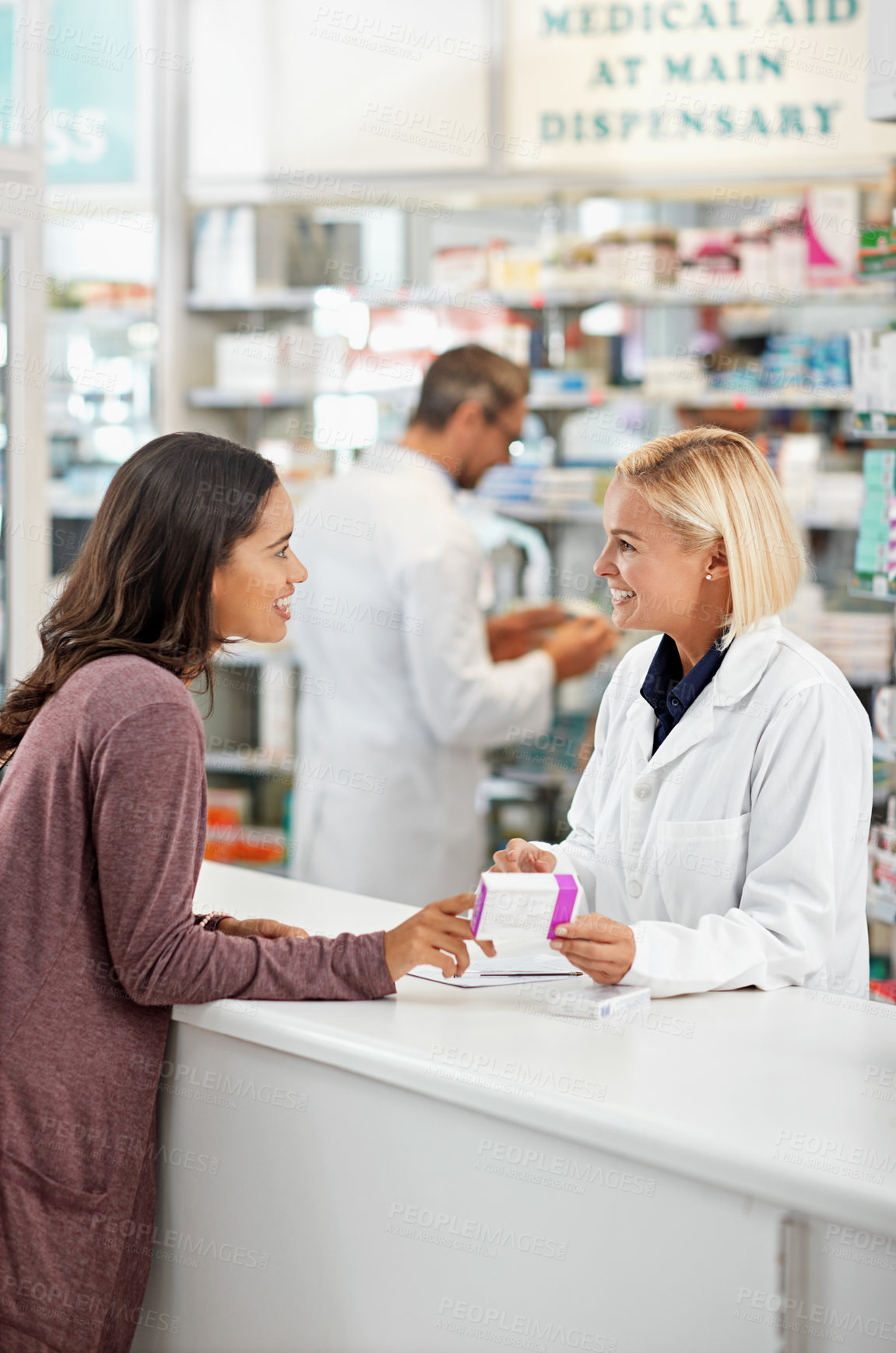 Buy stock photo Wellness, health and happy pharmacy customer at store counter for medicine expertise with smile. Pharmaceutical advice and opinion of woman pharmacist helping girl with medication information.