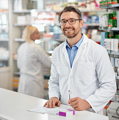 Buy stock photo Portrait, service and pharmacist man at counter for medicine help, expert advice and healthcare pharmacy. Retail desk, store and medical professional worker, doctor or person with a friendly smile