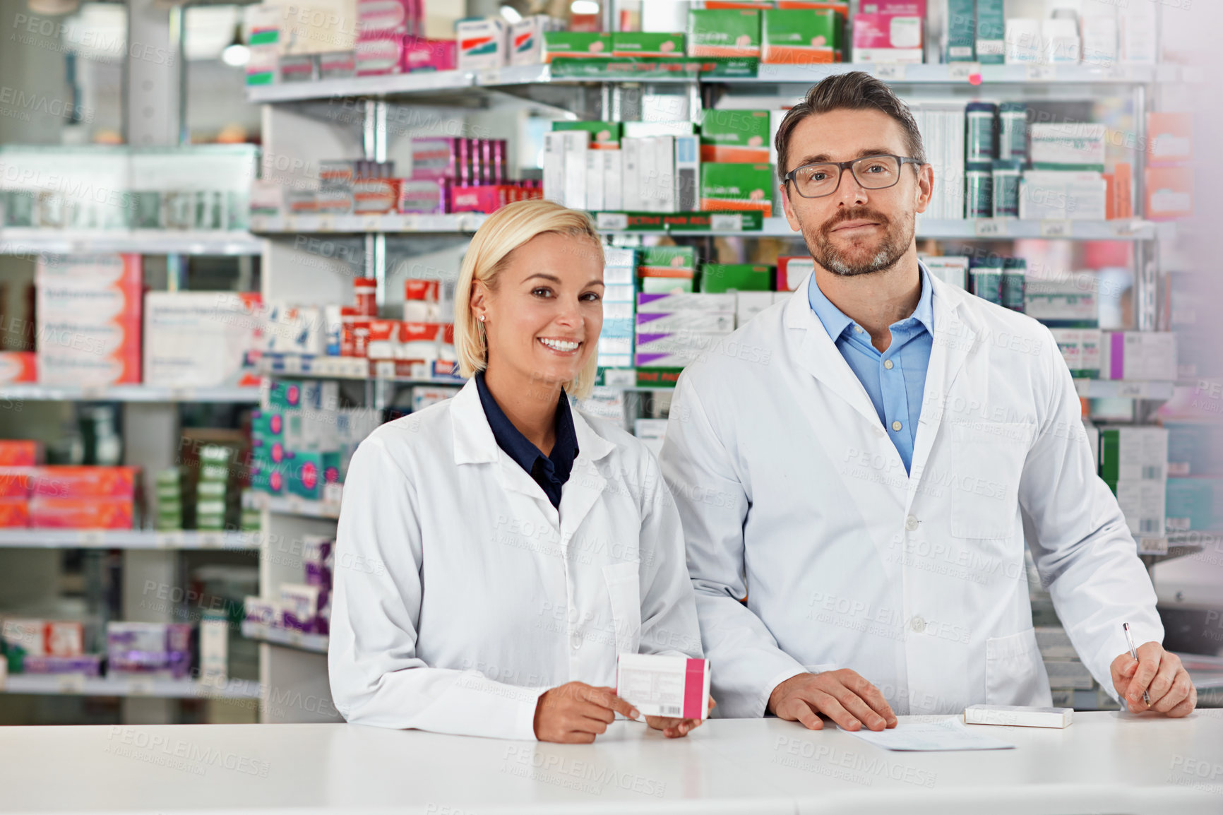 Buy stock photo Portrait, man and woman in pharmacy with prescription medicine box, healthcare and professional service in store. Health, drugs and pharmacist team in dispensary for medical advice, support or care