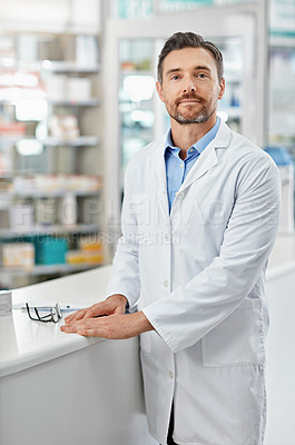 Buy stock photo Healthcare, portrait and mature man in pharmacy with confidence, pharmaceutical medicine or care in store. Health, service and face of professional pharmacist at dispensary counter for medical advice