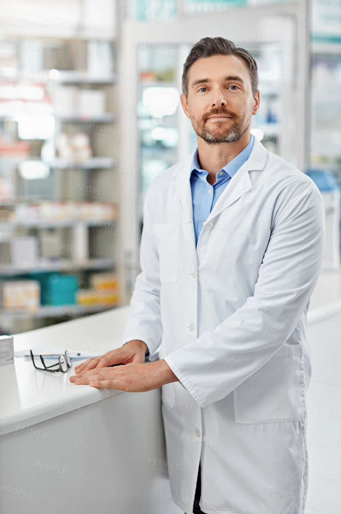 Buy stock photo Healthcare, portrait and mature man in pharmacy with confidence, pharmaceutical medicine or care in store. Health, service and face of professional pharmacist at dispensary counter for medical advice