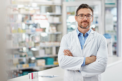 Buy stock photo Healthcare, crossed arms and portrait of a male pharmacist standing in a pharmacy clinic. Pharmaceutical, medical and mature man chemist with confidence by the counter of medication store dispensary.