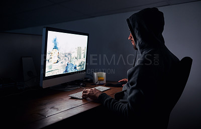 Buy stock photo Shot of a young man playing computer games at night