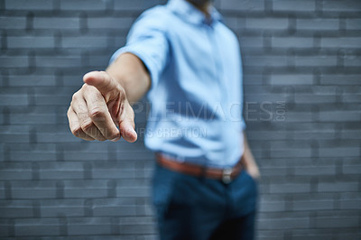 Buy stock photo Shot of a man pointing his finger forward