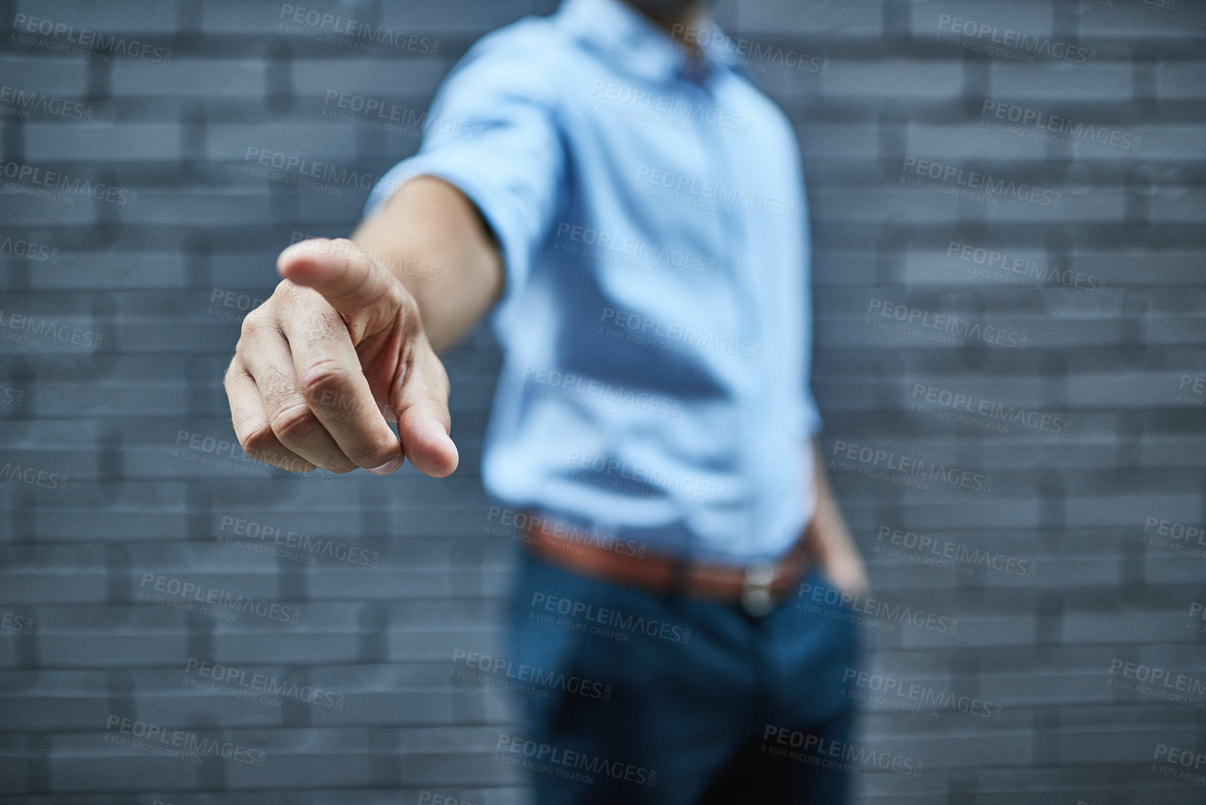Buy stock photo Shot of a man pointing his finger forward