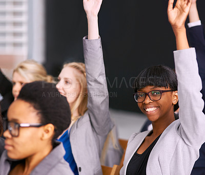 Buy stock photo Portrait of a young businesswoman raising her hand in a seminar meeting