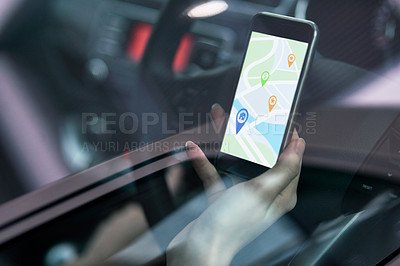 Buy stock photo Shot of a woman in a car using a phone to find directions