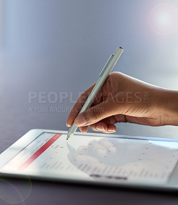 Buy stock photo Shot of a businesswoman using a stylus on a digital tablet