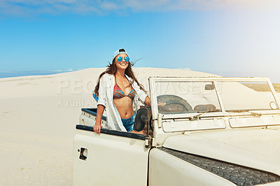 Buy stock photo Shot of a young woman going on a road trip in the desert