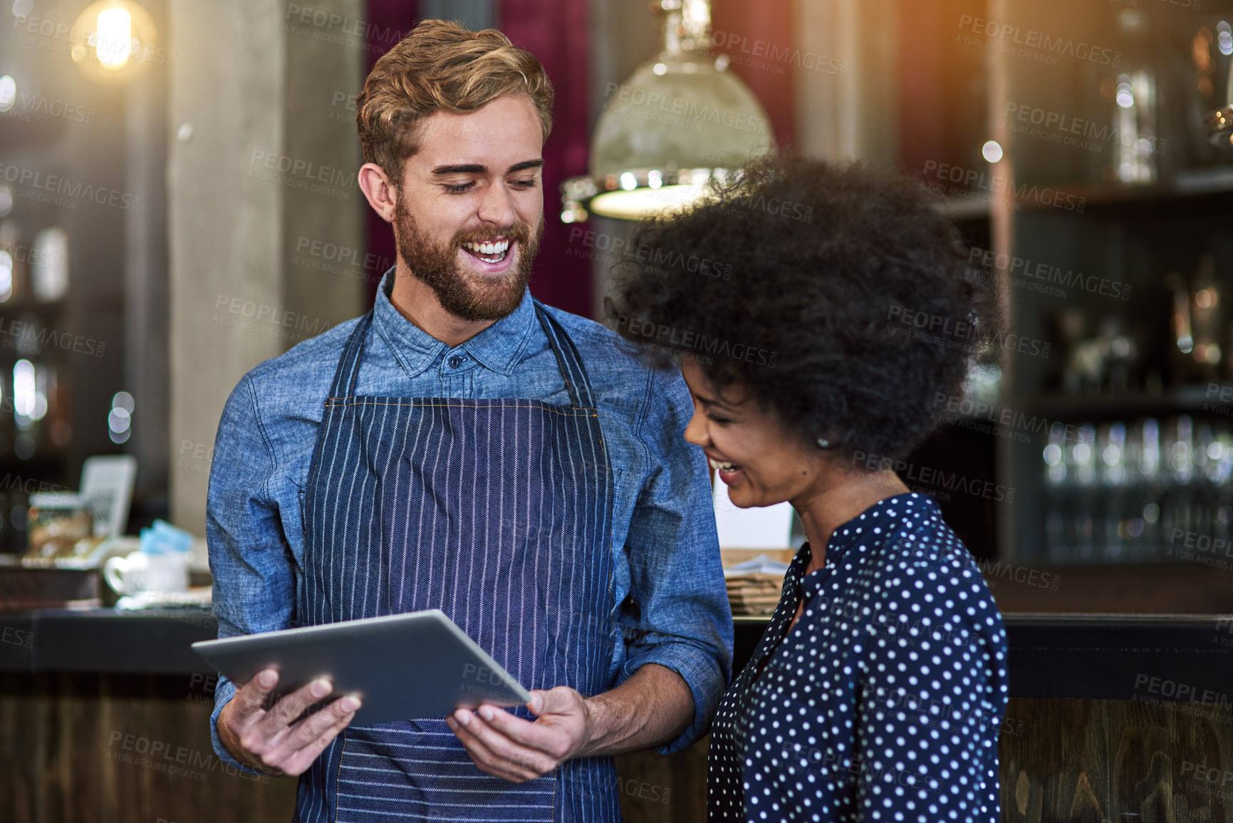 Buy stock photo Waiter, woman and happy with tablet in cafe for showing online menu, hospitality and help with decision. Barista, people and smile with digital app in coffee shop for order choice or customer service