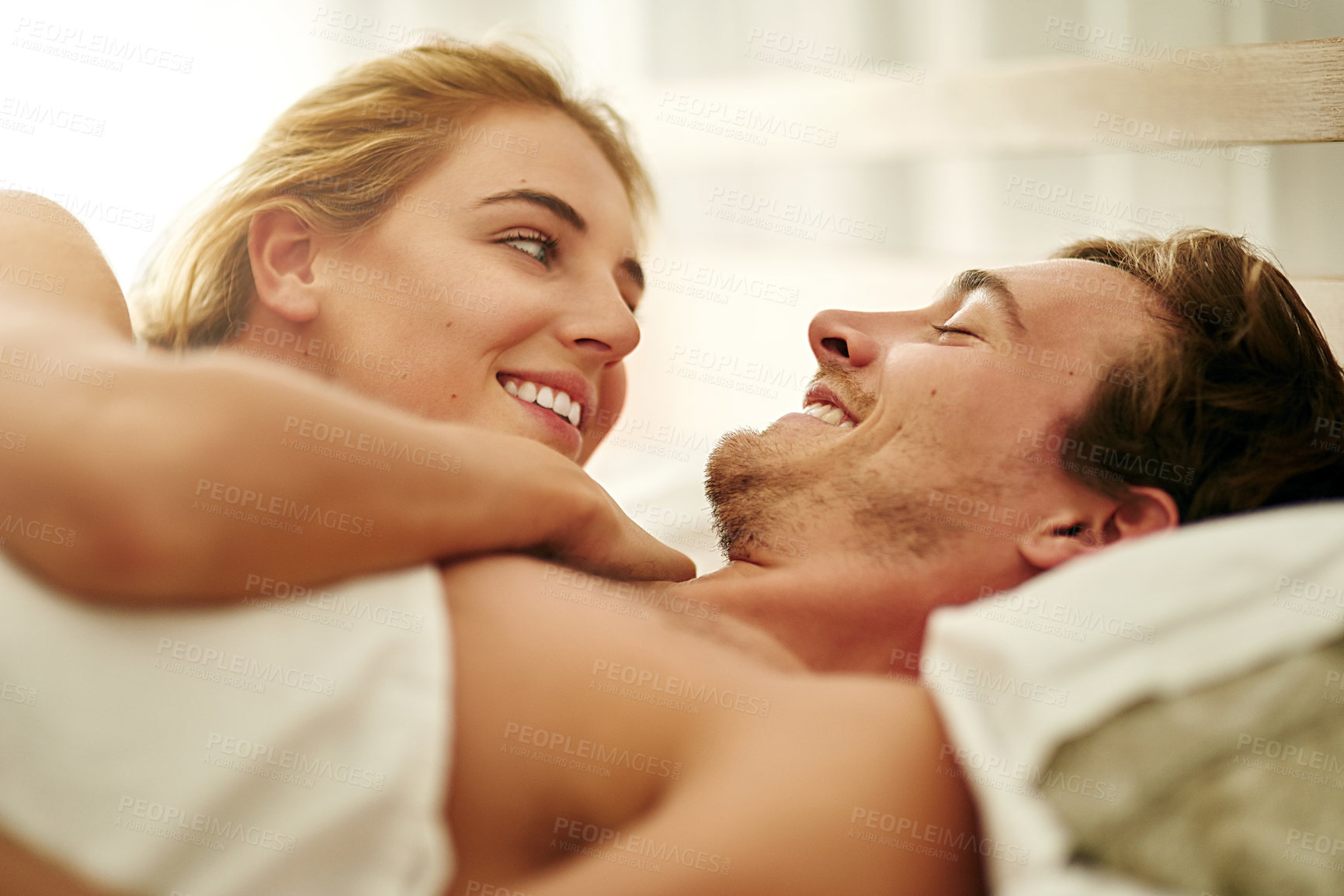 Buy stock photo Romance, morning and love with couple in bedroom for cuddle, valentines day and marriage. Honeymoon, getaway and care with man and woman at home or staycation for anniversary retreat and relax