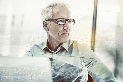 Buy stock photo Multiple exposure shot of a mature businessman using a laptop superimposed on a cityscape