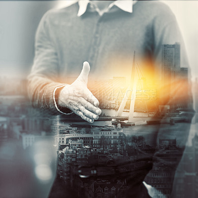 Buy stock photo Multiple exposure shot of a man  extending a handshake superimposed on a cityscape