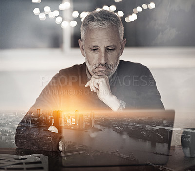 Buy stock photo Multiple exposure shot of a mature businessman using a laptop superimposed on a cityscape at dusk