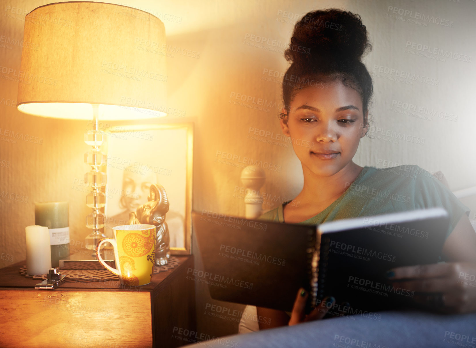 Buy stock photo Cropped shot of a young female student studying at home