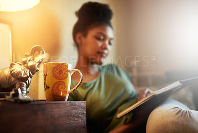 Buy stock photo Cropped shot of a young female student studying at home