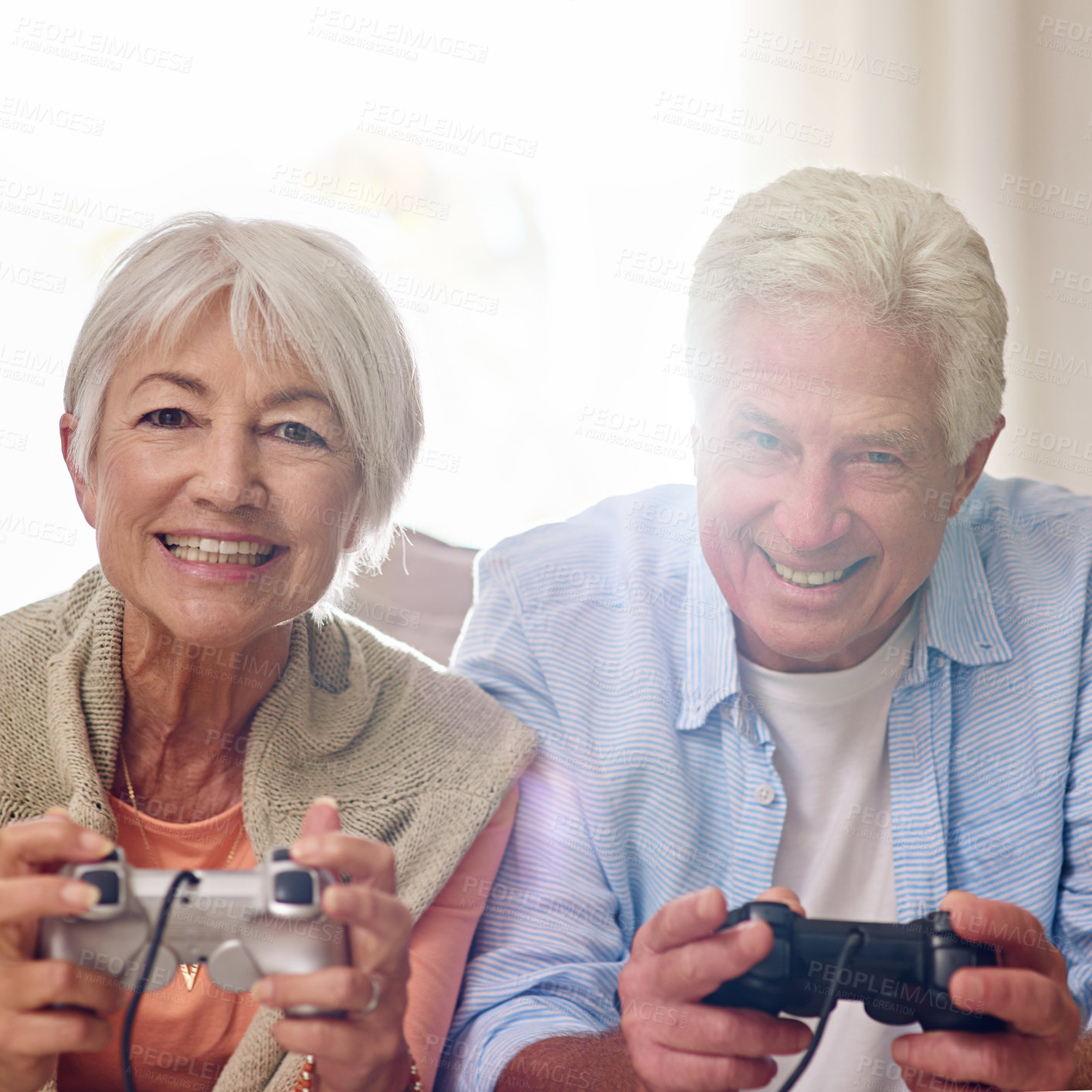 Buy stock photo Video game, smile and senior couple play together for entertainment, challenge or relax in home. Man, woman and gaming console for competition, online battle or contest in living room for retirement