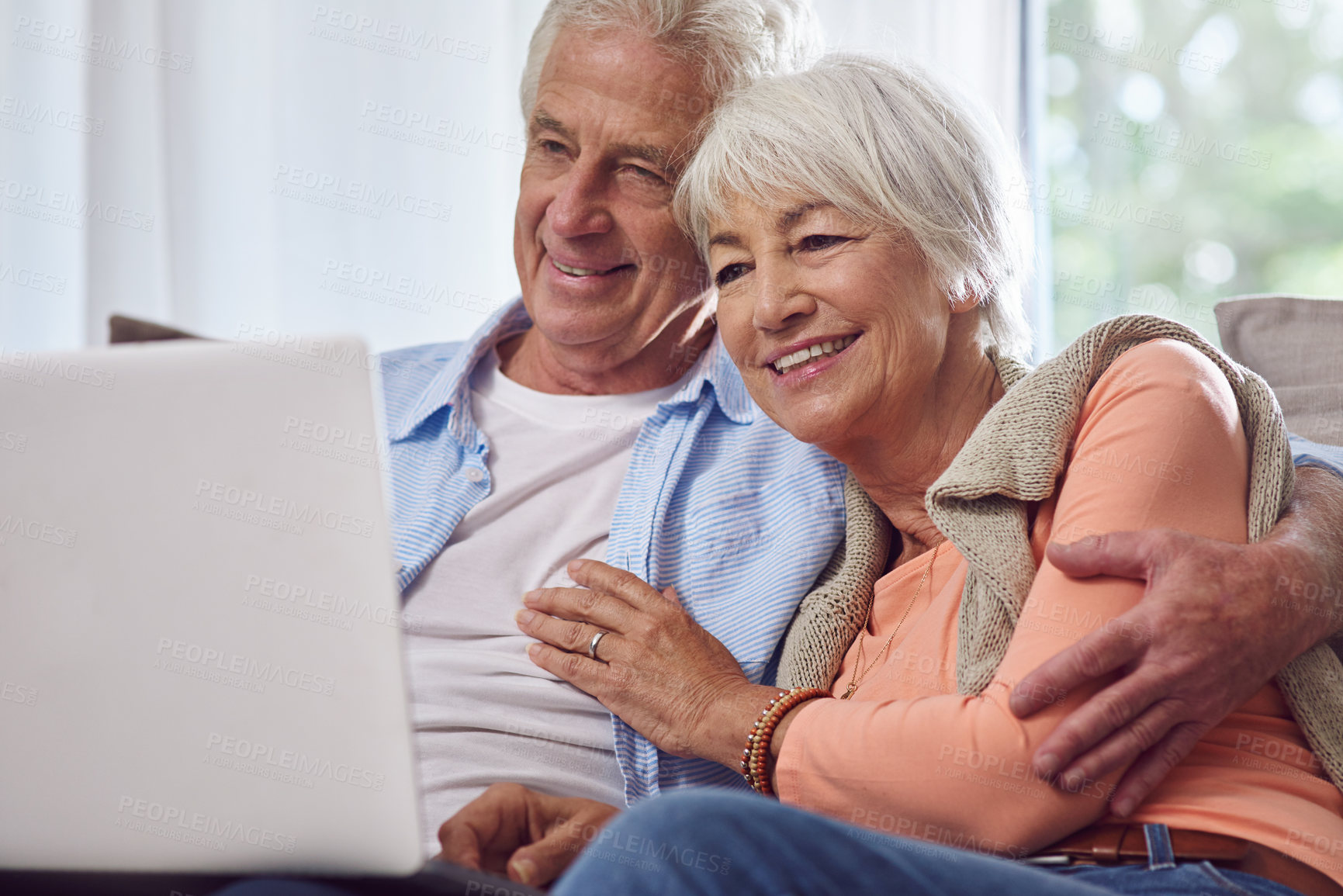 Buy stock photo Shot of a senior couple using a laptop at home