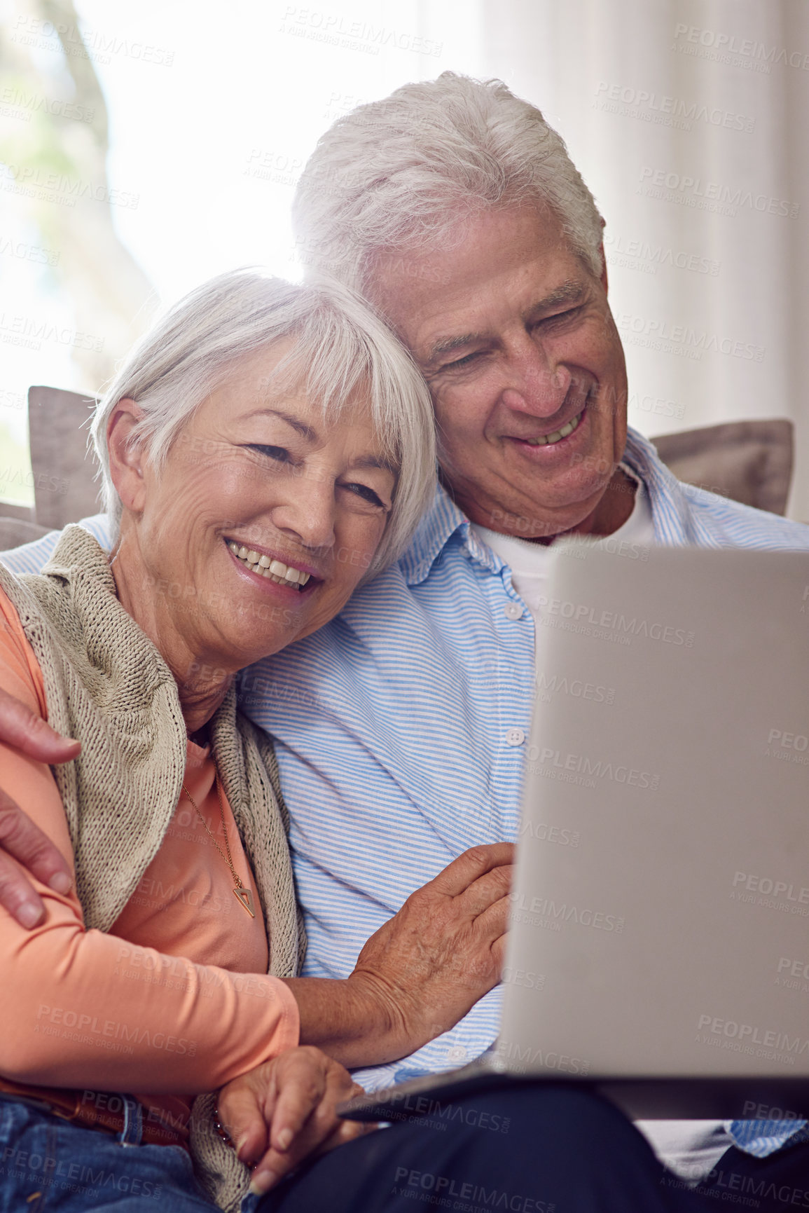 Buy stock photo Shot of a senior couple using a laptop at home