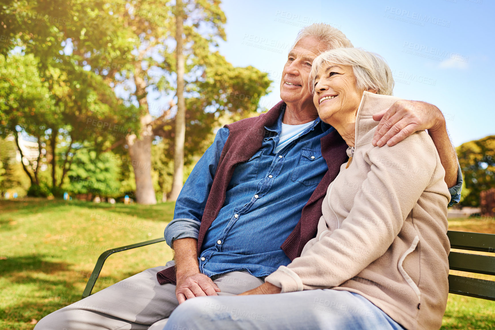 Buy stock photo Park, thinking and love with a senior couple sitting on a bench together on a summer day for romance. Nature, garden or memory with a mature man and woman bonding outdoor during retirement